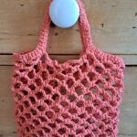 Petit sac “filet” orange corail lurex fait main confectionné au crochet